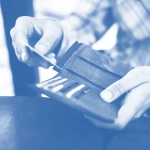man pulling a card out of his wallet